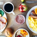 Vibrant breakfast with eggs, fruits, toast, and coffee for a wholesome start.
